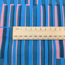 Load image into Gallery viewer, Ruby Star Society Fabric with blue and pink striped pattern and a wooden ruler for scale. Available at Minerva's Bower