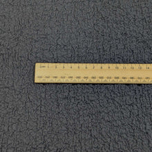 Load image into Gallery viewer, Flat lay of Cyndi Black textured stretch cotton, for sale at Minerva's Bower, with ruler included for scale
