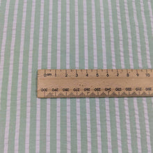 Load image into Gallery viewer, Flat lay of Joy cotton seersucker in mint colourway. Available at Minerva's Bower. Ruler included to show scale