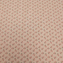 Load image into Gallery viewer, Japanese cotton fabric with a small floral pattern on a soft pink base, for sale at Minerva's Bower