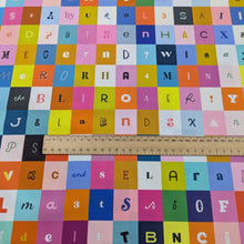 Load image into Gallery viewer, Flat lay of Ruby Star Cotton, Selvedge Magic, ruler includedfor sclae, for sale at Minerva's Bower