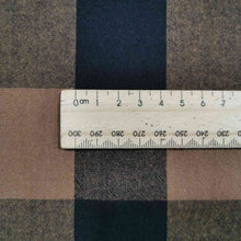 Load image into Gallery viewer, Beautiful yarn dyed pure cotton, in small gingham check of black and nutmeg. Image includes a ruler to show scale. Available now at Minerva's Bower