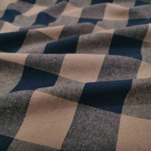 Load image into Gallery viewer, Beautiful yarn dyed pure cotton, in small gingham check of black and nutmeg. Fabric is draped across the bench. Available now at Minerva's Bower