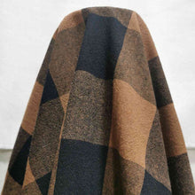 Load image into Gallery viewer, Beautiful yarn dyed pure cotton, in small gingham check of black and nutmeg. Fabric is draped over the roll. Available now at Minerva's Bower