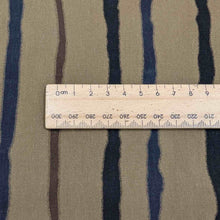 Load image into Gallery viewer, close up of 100% cotton fine twill, tracks, for sale at Minerva's Bower, ruler included for scale
