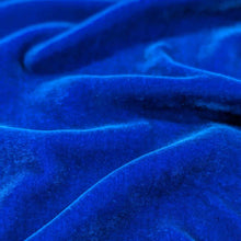 Load image into Gallery viewer, Flat lay of pure silk velvet in royal lcolourway. Available at MInerva's Bower. Fabric draped to show how it drapes