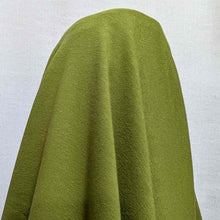 Load image into Gallery viewer, Flat lay of olympia heavyweight cotton spandex loopback in chartreuse colourway. Available at Minerva's Bower. Fabric draped to show how it handles