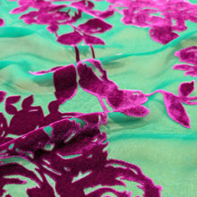 Load image into Gallery viewer, Flat lay of pure silk burnout velvet, in fuchsia floral design. Available at Minerva's Bower. Fabric draped to show how it handles
