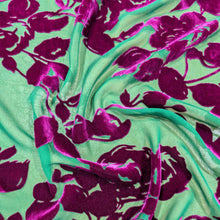 Load image into Gallery viewer, Flat lay of pure silk burnout velvet, in fuchsia floral design. Available at Minerva's Bower. Fabric draped to show how it handles