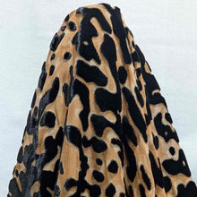 Load image into Gallery viewer, Flat lay of pure silk velvet burnout in a leopard print design. Available at Minerva's Bower. Fabric draped to show how the fabric handles