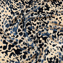 Load image into Gallery viewer, Flat lay of pure silk velvet burnout in a leopard print design. Available at Minerva's Bower. Fabric draped to show how the fabric handles