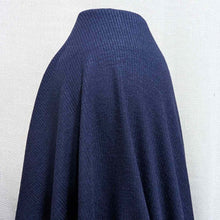 Load image into Gallery viewer, Flat lay of Stellar rayon rib, in indigo colourway. Available at Minerva's Bower. Fabric draped to show how it handles