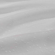 Load image into Gallery viewer, Flat lay of white Zola swiss dot embroidered pure cotton. Available at Minerva's Bower. Fabric draped to show how it handles