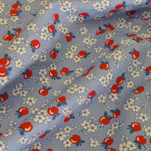 Load image into Gallery viewer, Flat drape of fabric with red apples and white flowers on a blue background in a vintage style, for sale at Minerva&#39;s Bower