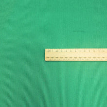 Load image into Gallery viewer, Flat lay of Albie 11 Wale Cord, Grass, for sale at Minerva's Bower, with ruler included for scale