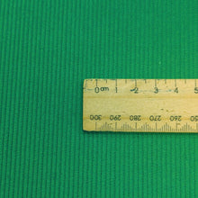 Load image into Gallery viewer, Close up flat lay of Albie 11 Wale Cord, Grass, for sale at Minerva's Bower, with ruler included for scale