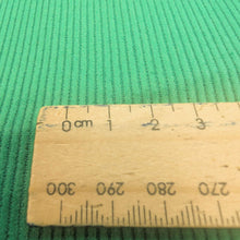 Load image into Gallery viewer, Extra close up flat lay of Albie 11 Wale Cord, Grass, for sale at Minerva's Bower, with ruler included for scale