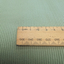 Load image into Gallery viewer, Close up flat lay of Albie 11 Wale Cord, Sage, for sale at Minerva's Bower, with ruler included for scale