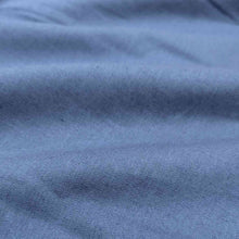 Load image into Gallery viewer, Flat lay of Anderson linen cotton in bluebell colourway. Available at Minerva&#39;s Bower. Fabric draped to show how it handles