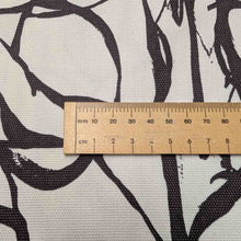 Load image into Gallery viewer, Fabric with black abstract pattern on a white background, ruler for scale. Avialable at Minerva's Bower