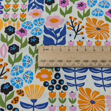 Load image into Gallery viewer, Colorful floral patterned 100% cotton fabric with a ruler for scale, for sale at Minerva&#39;s Bower