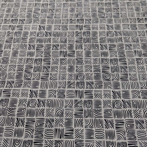 Art Gallery 100% cotton cloth with a Black geometric woodblock pattern on a cream base, for sale at Minerva's Bower