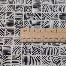Load image into Gallery viewer, Woodblock patterned 100% cotton     fabric with a ruler for scale on a cream background, for sale at Minerva&#39;s Bower