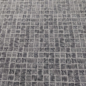 Art Gallery 100% cotton cloth with a Black geometric woodblock pattern on a cream base, for sale at Minerva's Bower