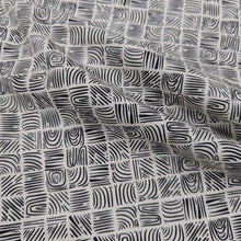 Load image into Gallery viewer, Black and cream woodblock patterned 100% cotton Art Gallery fabric, draped to show weight