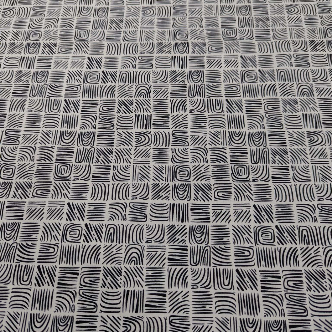 Art Gallery 100% cotton cloth with a Black geometric woodblock pattern on a cream base, for sale at Minerva's Bower