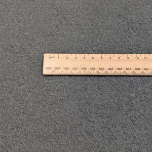 Flat lay of Boiled Wool 60% Viscose 40% Blend, Olive, for sale at Minerva's Bower, ruler included for scale