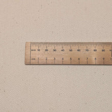 Load image into Gallery viewer, Close up flat lay of 100% Calico Drill, with ruler included - for sale at Minerva's Bower