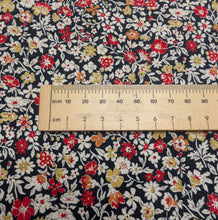 Load image into Gallery viewer, Close up flat lay of Claudia 100% Cotton Pinwale Cord in Black by Kokka, ruler included for scale - for sale at Minerva's Bower 