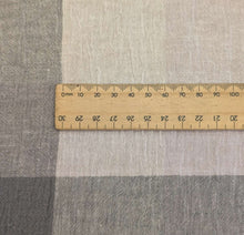 Load image into Gallery viewer, Close up of Tonal grey Yarn dyed crinkle 55% linen 45% cotton check available at Minerva&#39;s Bower with ruler included for scale