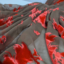 Load image into Gallery viewer, orange floral devore silk velvet on chocolate base. Available at Minerva's Bower. Fabric draped to show how it handles