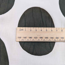 Load image into Gallery viewer, Flat lay of Crinkle Spot, a cream and Olive cotton Voile. Available at Minerva&#39;s Bower. A ruler is included for scale