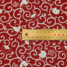 Load image into Gallery viewer, Red cotton fabric with white cat pattern. Made in Japan. Available at Minerva's Bower. Ruler included for scale