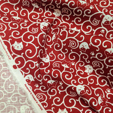 Load image into Gallery viewer, Red cotton fabric with white cat pattern. Made in Japan. Available at Minerva's Bower. Fabric draped to show how it handles