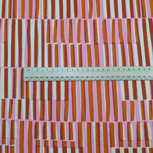 Ruby Star Society Fabric with pink and brown striped pattern and a ruler for scale. Available at Minerva's Bower