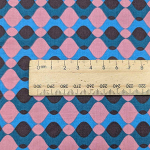 Ruby Star Society Fabric with a geometric pattern and a ruler for scale. Available at Minerva's Bower