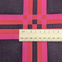 Load image into Gallery viewer, Flat lay of triple gauze Fabric with a checkered pattern of pink, orange, and black on a black background. Available at Minerva&#39;s Bower. Ruler included for scale