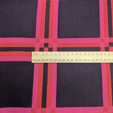 Load image into Gallery viewer, Flat lay of triple gauze Fabric with a checkered pattern of pink, orange, and black on a black background. Available at Minerva&#39;s Bower. Ruler included for scale