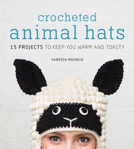 Book cover of 'Crocheted Animal Hats' by Vanessa Moondie with a person wearing a cat-themed crochet hat, available at Minerva's Bower