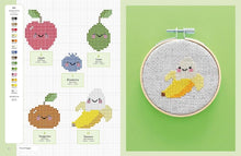 Load image into Gallery viewer, Cross-stitch pattern with cartoon fruits and a completed banana design in an embroidery hoop, from Cute Kawaii Cross Stitch, available now at Minerva&#39;s Bower