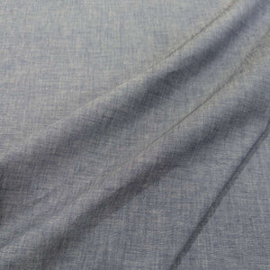 Close-up of textured Japanese 100% cotton denim fabric with folds, for sale at Minerva's Bower