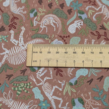 Load image into Gallery viewer, Close up flat lay of 100% Cotton Poplin, Dinos Dig, ruler included for scale - for sale at MInerva's Bower