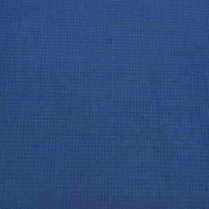 Flat lay of cotton linen dobby check in indigo. Available at Minerva's Bower