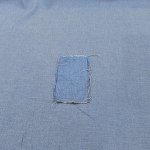 Washed swatch on unwashed cloth of Medium weight 100% cotton Donna Denim Chambray Twill rope dyed Japanese denim for sale at Minerva's Bower 