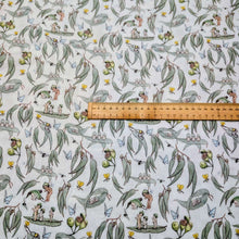 Load image into Gallery viewer, Flat lay of 70% Bamboo 30% Cotton Double Gauze, May Gibbs Garden Playtime, White, ruler included for scale - for sale at Minerva's Bower