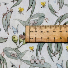 Load image into Gallery viewer, Close up of 70% Bamboo 30% Cotton Double Gauze, May Gibbs Garden Playtime, White, ruler included for scale - for sale at Minerva's Bower